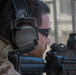 Man wearing ComTac VI NIB Headset on tan mesh background