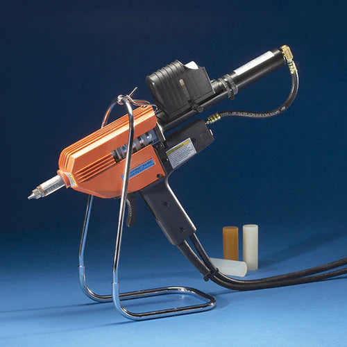 various color 3M glue gun PG II on blue background